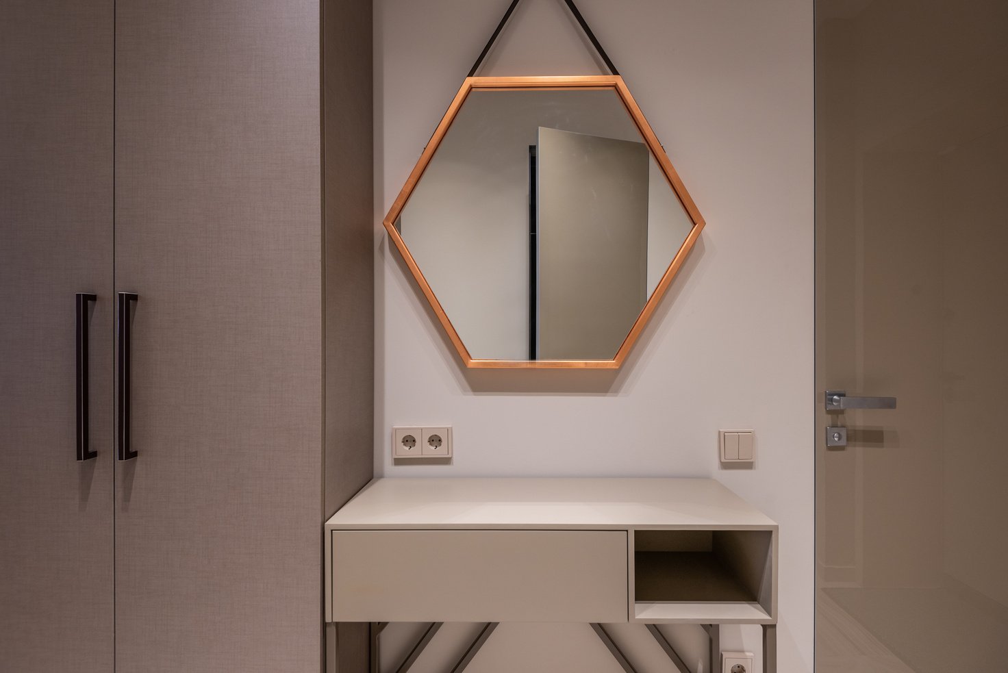 Mirror above cabinet and sockets at home